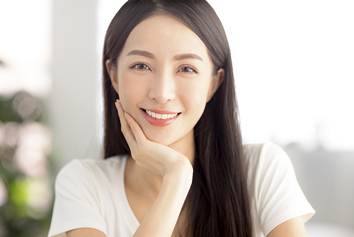 closeup  young asian woman face with clean  healthy skin