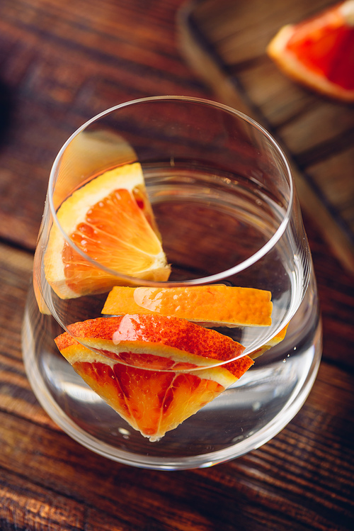 Detox water with blood oranges in drinking glass