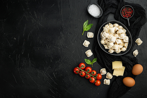 Raw Ravioli ingredients set, on black background, top view flat lay , with copyspace  and space for text