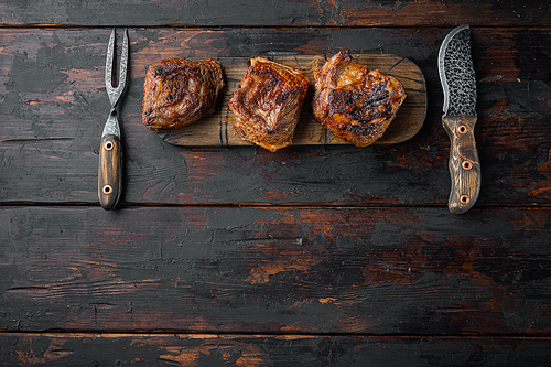 Barbecue chuck beef ribs set, on old dark  wooden table background, top view flat lay, with copy space for text