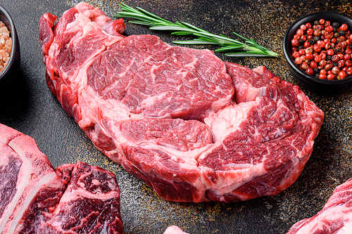 Rib eye beef steak raw set, on old dark rustic background