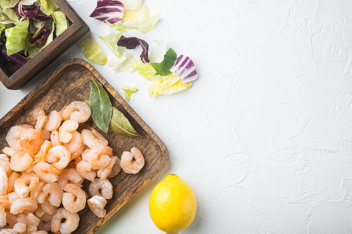 Seafood salad or appetizer shrimp and other ingredients set, with sauce apple and grape, on white stone  background, top view flat lay, with copy space for text
