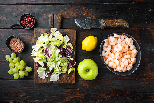 Whole fresh raw shrimp peeled boiled for Waldorf prawn salad set, with sauce apple and grape, on old dark  wooden table, top view flat lay