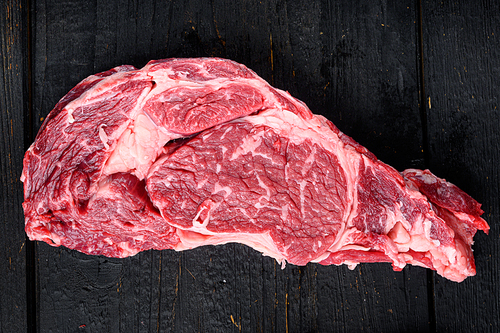 Raw fresh organic top choice meat ribeye steak set, on black wooden table background, top view flat lay