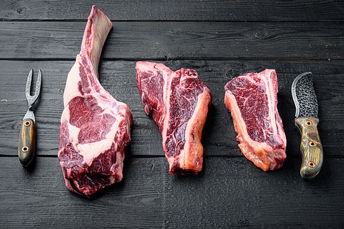 Dry aged Raw porterhouse beef meat Steak set, tomahawk, t bone or porterhouse and club steak, on black wooden table background