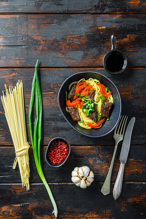 Soba noodles with beef, carrots, onions and sweet peppers. Top view.