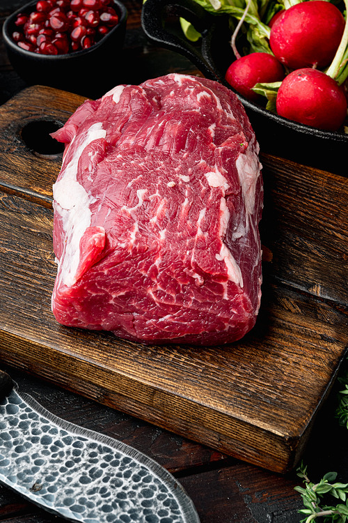 Tenderloin fillet mignon whole cut set, on old dark  wooden table background