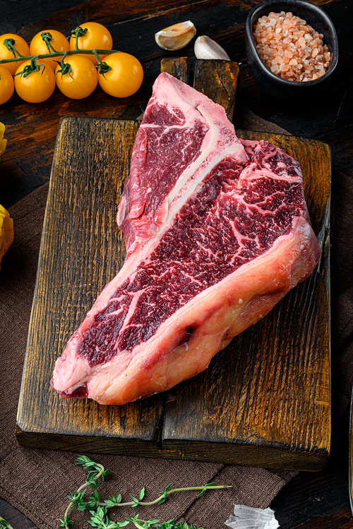 Italian Florentine T-bone beef meat Steak with herbs set, on old dark  wooden table background