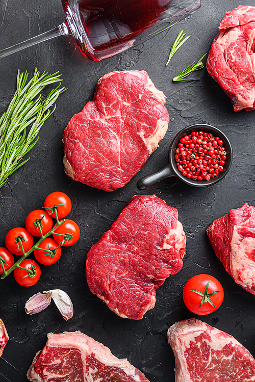 Two rump  beef steak cuts, with herbs, seasoning  on black table, top view