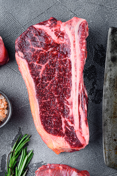 Food concept organic feed raw meat beef steak set, Club steak cut, on gray stone background, top view flat lay