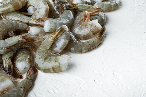 Tiger Prawns or Asian tiger Shrimps set, on white stone  surface, with copy space for text