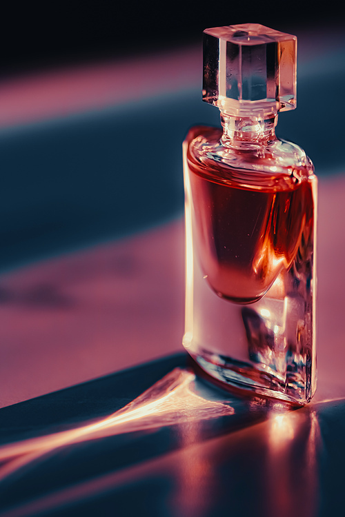 Perfume bottle at sunset, perfumery as luxury beauty and cosmetic product.