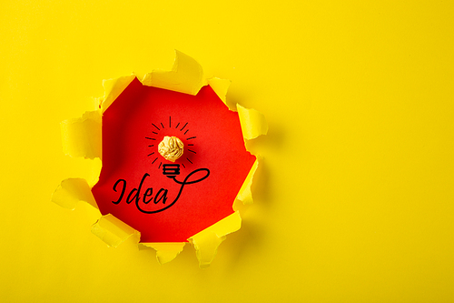 Creative idea, Inspiration, New idea and Innovation concept with Crumpled Paper light bulb on yellow background.