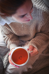 Conceptual Take your time Girl Holding a Cup of Tea