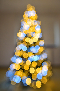 Abstract Shaped Light Bokeh On A Christmas Tree Inside oh House