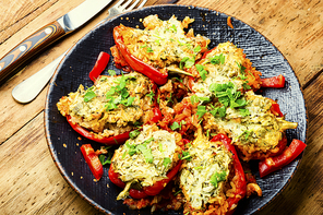 Sweet peppers stuffed with turkey, herbs and rice. Sweet peppers baked with satsiki sauce