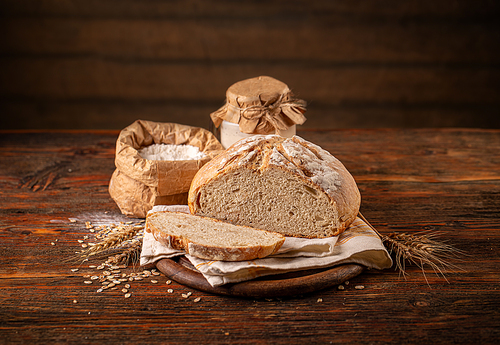 Freshly backed sourdough bread on wooden background