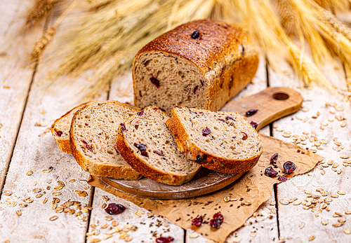 Cranberry bread loaf on wooden background