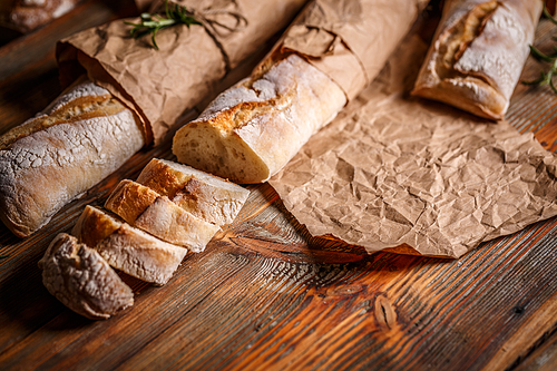 French bread baguettes on rustic wooden background