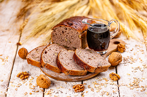 Walnut loaf bread on wooden background