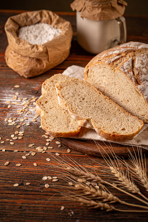 Wheat sourdough in glass jars and flour for baking homemade bread