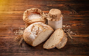 Freshly backed sourdough bread on wooden background