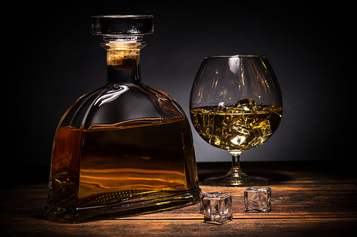 Cognac in a brandy glass with ice cube