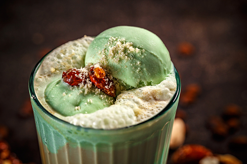 Close up of coffee latte with pistachio ice cream