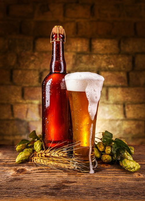 Still life of beer between brick wall