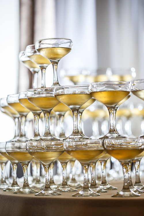 Champagne glasses pyramid on restaurant table