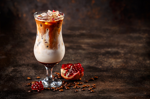 Iced coffee latte with pomegranate syrup, space for your text