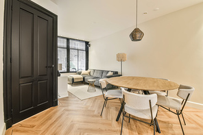 The interior of the living room with a dining area in a cozy house