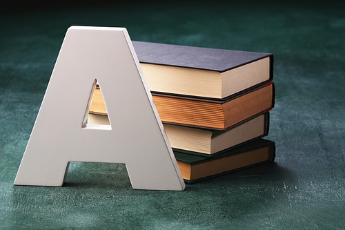 alphabet A in front of books