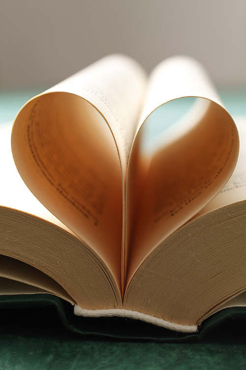 Close up of book pages forming heart