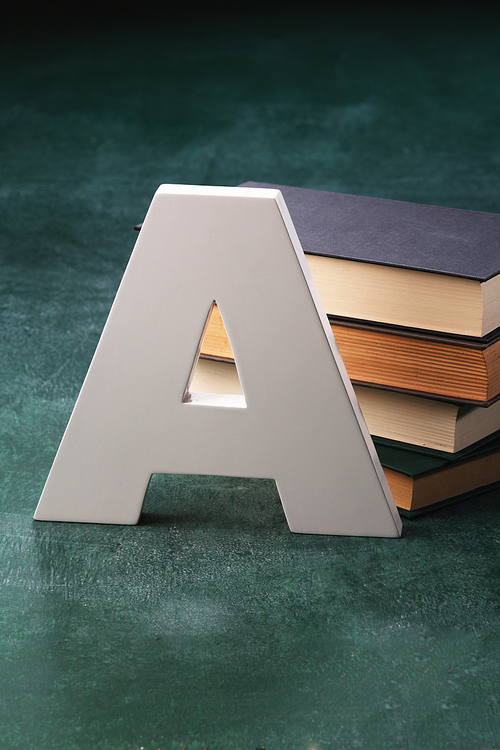 alphabet A in front of books