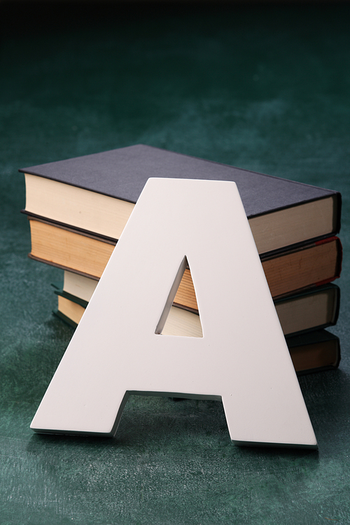 alphabet A in front of books