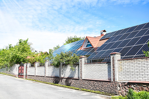 solar panels, Close up shot of a solar panel array with blue sky, Solar panels on a roof for electric power generation, Solar panel on a red roof reflecting the sun