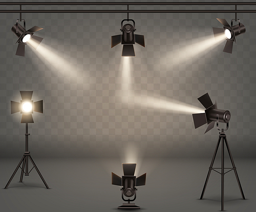 spotlights realistic vector set. professional photo and video lamps, hanging and standing on tripod, stage equipment with warm yellow light on transparent .