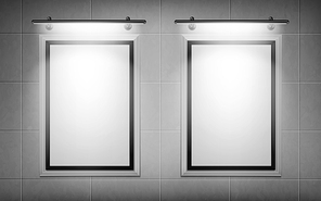 blank movie posters illuminated by spotlights. vector realistic mockup of white picture s on gray tiled wall in cinema, theater or gallery. empty advertising banners with black border and lamps