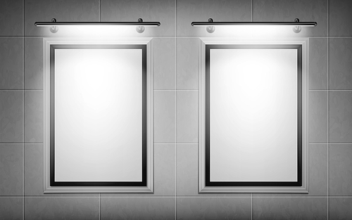 blank movie posters illuminated by spotlights. vector realistic mockup of white picture s on gray tiled wall in cinema, theater or gallery. empty advertising banners with black border and lamps