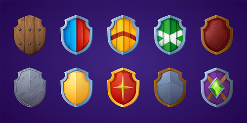 Set of game shields, cartoon fantasy medieval armor of metal and wood. Knight ammo, iron or wooden guard collection, ui design elements, military screens front view isolated vector icons, clipart