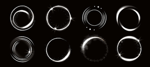 Light circles with sparkles, magic glow effect. Vector realistic set of white shiny rings and swirls, round frames of flare trail with glitter dust isolated on black 