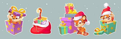Set of stickers New Year tiger in Santa hat, 2022 chinese zodiac symbol. Wild cute kitten, baby predator animal, cartoon cub character sit in gift box, in sack with presents, waving paw Vector patches