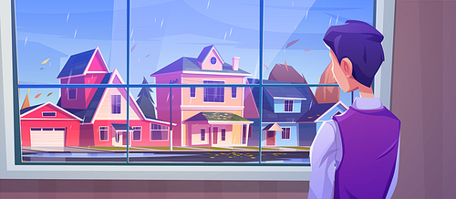 Man looking at window at autumn landscape of city street in rain. Vector cartoon illustration of town with houses, road, leaves fall and person standing inside home