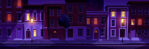 Cartoon city street at night. Vector illustration of town apartment houses with cozy yellow light in windows on brick wall facade, empty street, road illuminated with light posts. Urban neighborhood