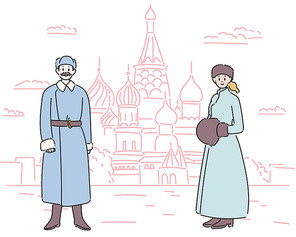 러시아 전통의상을 입은 커플이 성바실리 대성당앞에 서있다.