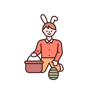 토끼 머리띠를한 소년이 계란을 바구니에 담고 있다.