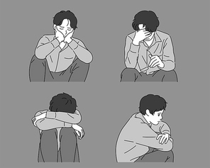 한 남자가 쪼그려 앉아 상심에 빠져 있다.