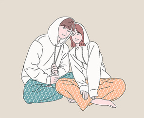 커플잠옷을 입은 남자와 여자. 손그림 스타일 일러스트레이션.