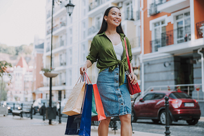Happy Asian lady after shopping stock photo